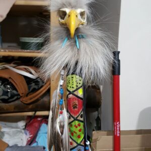 Painted ceremonial walking stick with hand carved eagle head on top