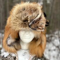 Fur hat displayed on a mannequin head.